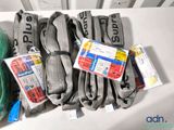 several pairs of gray socks are sitting on a white table