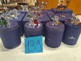 a lot of glass figurines sitting on a table