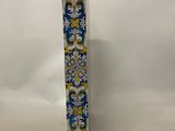a blue and yellow book with a floral design on it