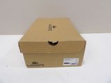a cardboard box with a handle on it sitting on a table