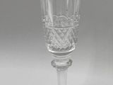 a wine glass that is sitting on a table