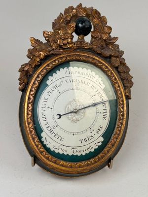 a clock that is sitting on a white table