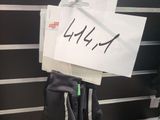 a sign hanging on the wall with a pair of gloves