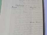 an old document with writing on it sitting on a table
