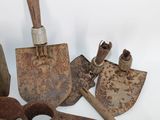 a lot of old tools that are sitting on a table