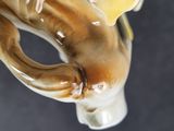a close up of a coffee cup with a horse on it