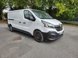 a white van that is parked on the side of the road