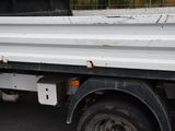 a white truck that is parked on the street