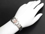 someone is wearing a watch on their wrist on a mannequin hand
