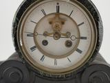 a clock that is sitting on top of a table