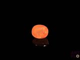 a glowing orange ball in the dark of the night