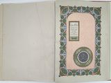 an open book with a picture of a medallion on it