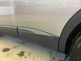a close up of a car that has been painted silver
