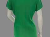 the back of a mannequin wearing a green shirt and black pants