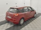 a picture of a red car parked in a garage