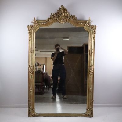a woman taking a picture of herself in a mirror