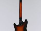 an electric guitar hanging from a string on a white background