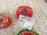 two pieces of watermelon sitting on a table
