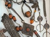 a white box filled with assorted necklaces and bracelets