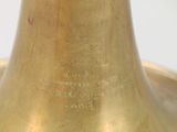 a close up of a brass bell on a table