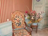 two chairs and a table in the corner of a room