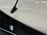 a close up view of a car ' s hood with a sticker on it