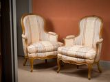 two chairs sitting next to each other in a room