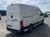 a white van that is parked in a parking lot