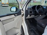 a white car that is parked on the side of the road