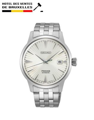 a close up of a wrist watch with a white dial