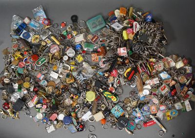 a pile of assorted key chains on a table