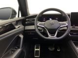the interior of a car with a steering wheel, dashboard, and dashboard controls