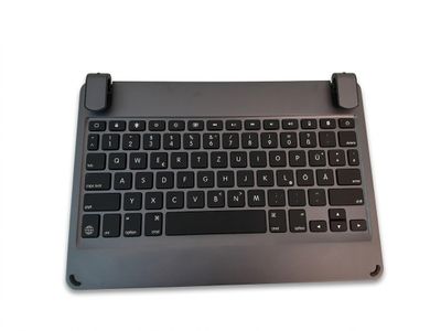 a close up of a black keyboard on a white surface