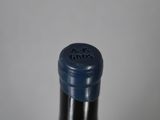 a close up of a bottle of wine on a table