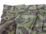 the pants are camouflaged and have buttons on the side