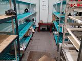 a room with a lot of shelves and shelves in it