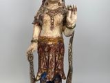 an image of a statue of a woman holding a staff