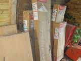 a pile of boxes and other items in a shed
