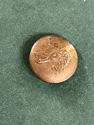 une pièce sur laquelle est représenté un dragon
