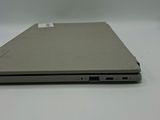 an open laptop computer sitting on top of a white table