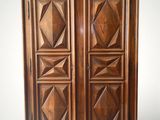 an image of a wooden armoire with four doors on one side and a drawer on the other