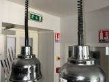 two lights that are hanging from the ceiling in the kitchen