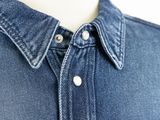 a close up of a shirt with buttons on a mannequin mannequin