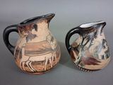 two vases sitting side by side on a table