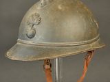 an old helmet on a stand on a gray background