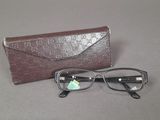 a pair of glasses and a case on a table