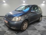 a picture of a small blue car parked in a garage