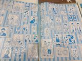 an open book with pictures of people and animals on it
