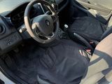 a small car with a steering wheel and a bag in the passenger seat