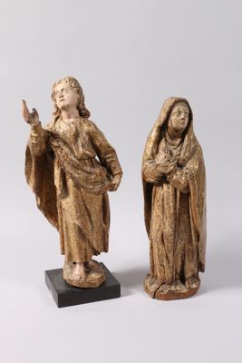 two statues of jesus and mary are shown on a white background